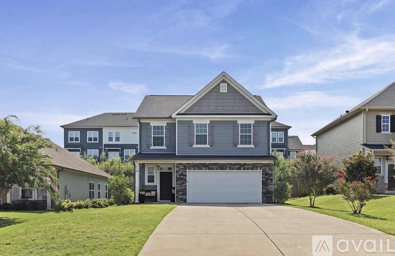 A house with a garage is available for sale.