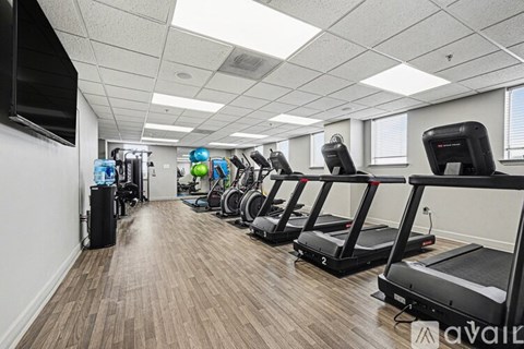 A gym with treadmills and exercise equipment.