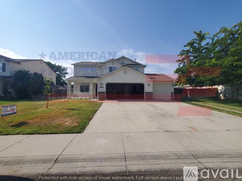 A house with a sign that says "AMERICAN" in front of it.