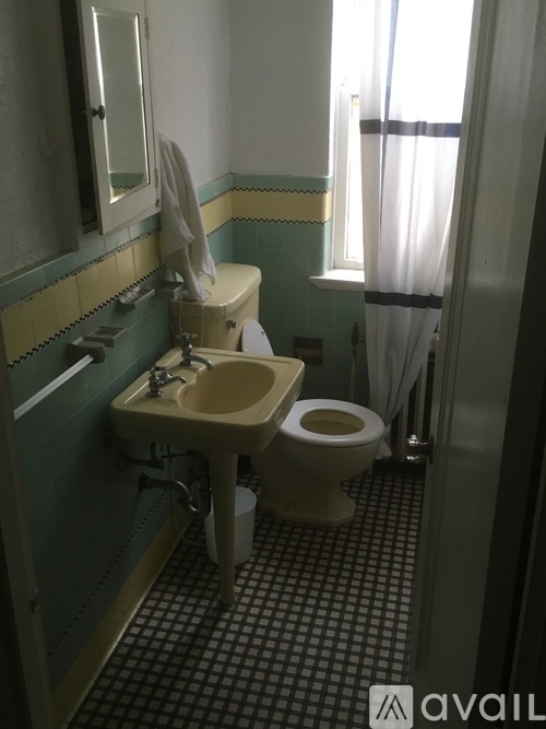 A bathroom with a toilet and sink.