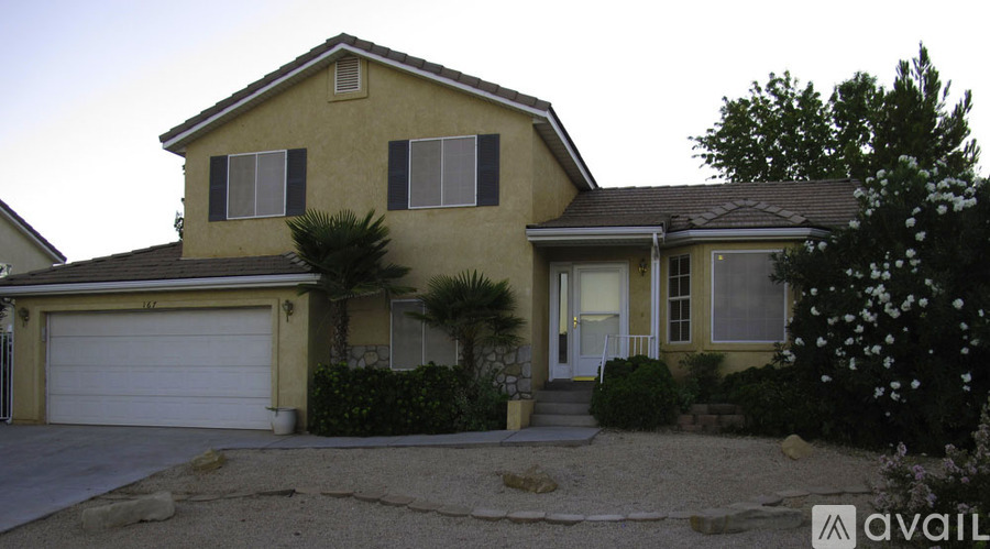 A house with a garage and a driveway.