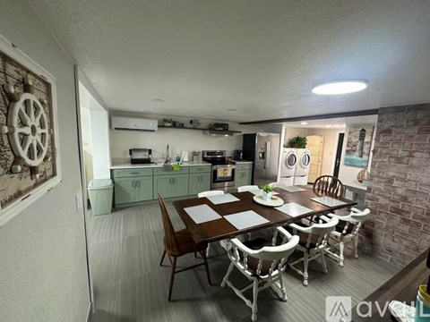 A dining area with a table set for four.