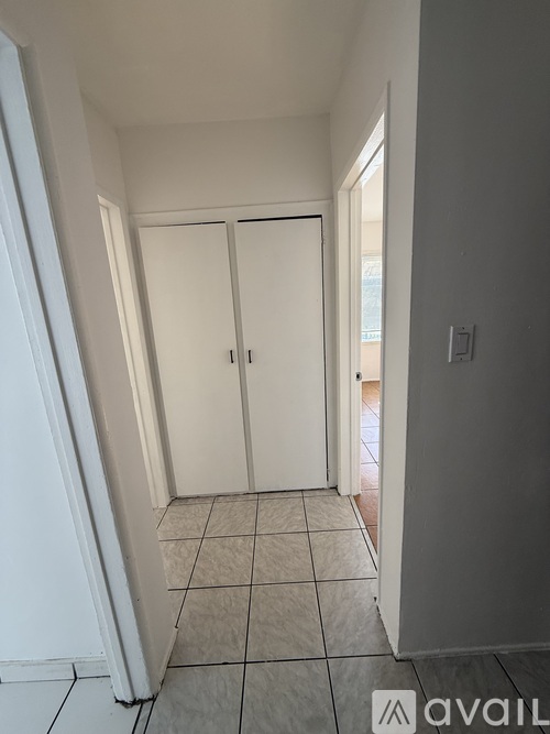 A room with a tiled floor and white walls.