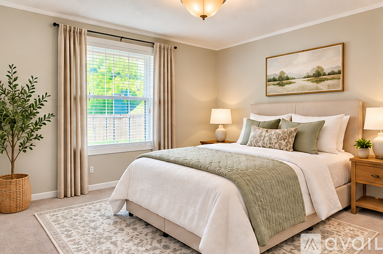 A bedroom with a large bed and a painting on the wall.