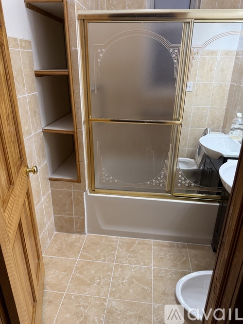 A bathroom with a walk in shower and a toilet.