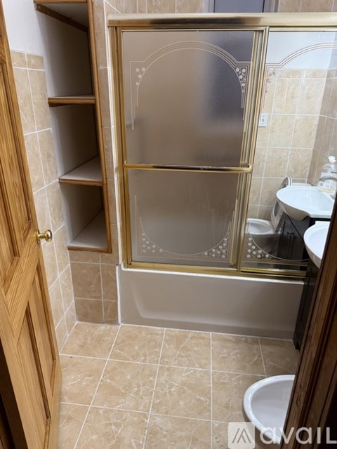 A bathroom with a walk in shower and a toilet.