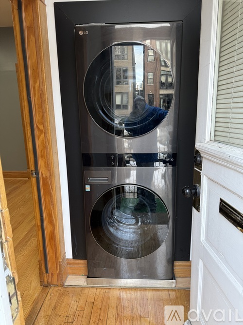 A modern LG washing machine with a transparent door.