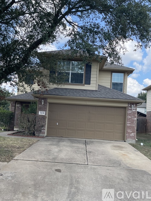 A house with a garage and a driveway.