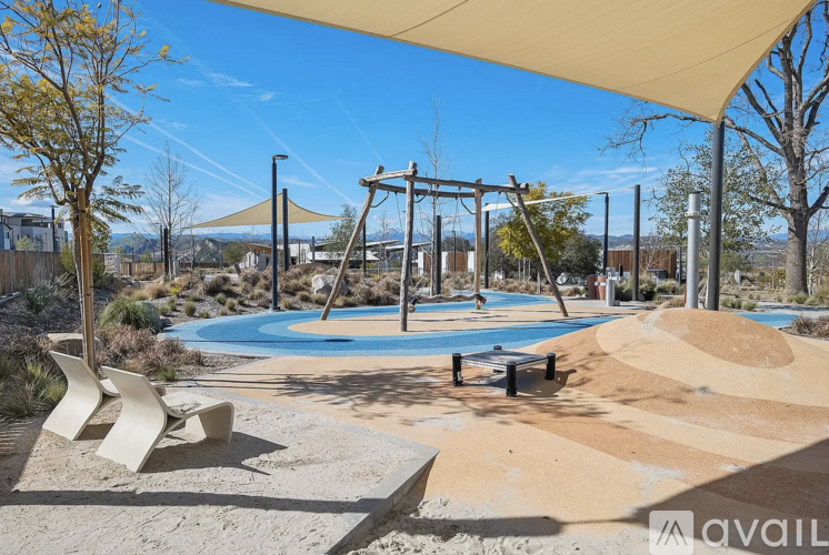 A playground with a swing set and a sandbox.