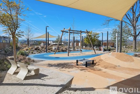 A playground with a swing set and a sandbox.