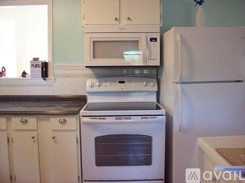 A room with three white doors and a carpeted floor.