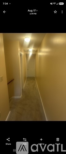 A long hallway with doors on both sides.