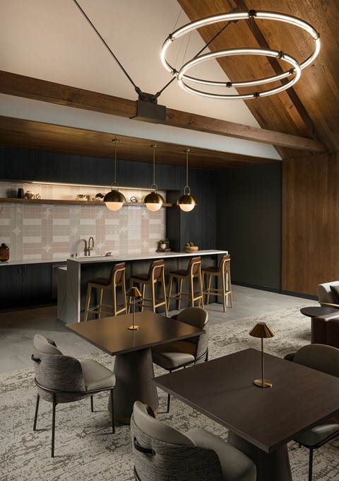 A modern dining room with a wooden table and chairs.