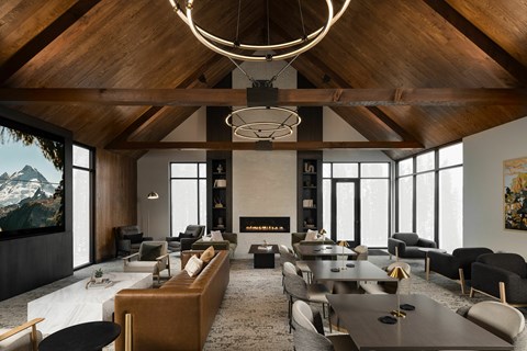 A modern living room with a fireplace and a large painting on the wall.