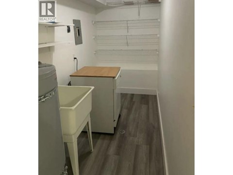 A small room with a table and a cabinet.