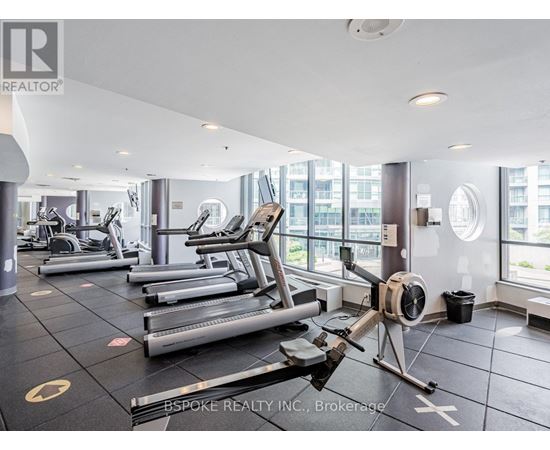 A gym with treadmills and elliptical machines.