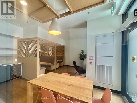 A conference room with a long table and chairs.