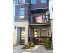 A building with a balcony and a sign that says "HOMELESS MAPLE LEAF REALTY LTD. BROKERAGE".
