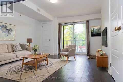 A living room with a sofa, a coffee table, and a chair.