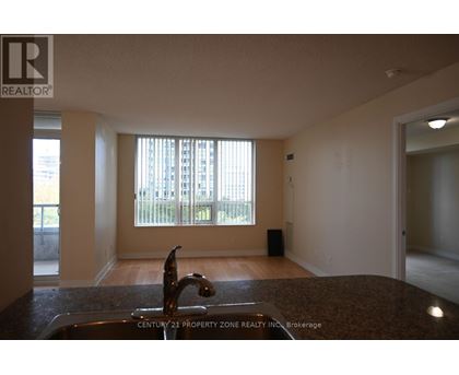 A kitchen with a sink and a window.