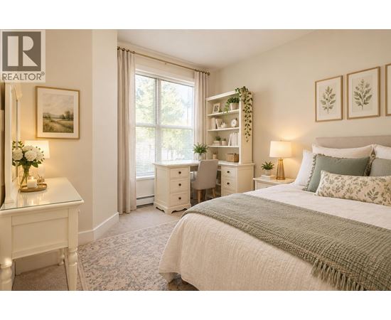 A bedroom with a large bed, a desk with a chair, and a window with a view of trees.