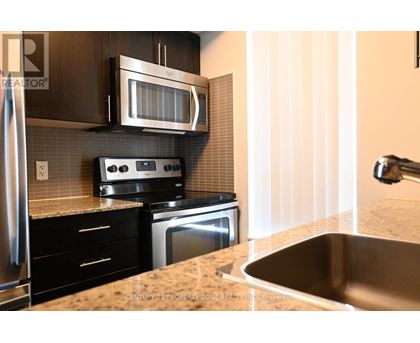 A kitchen with a stove top oven and microwave above it.