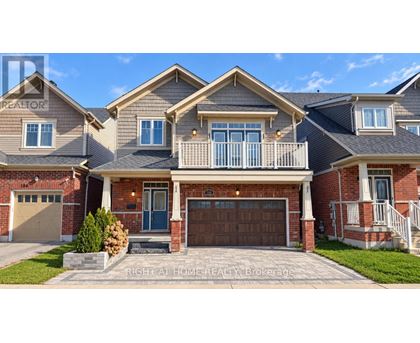 A large house with a garage and a balcony.