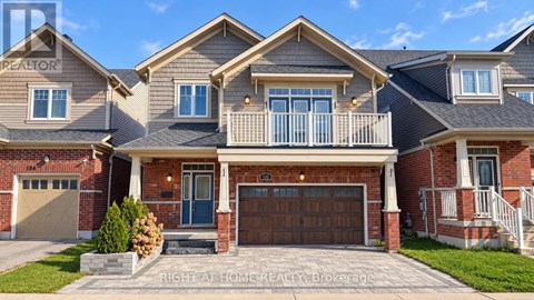 A large house with a garage and a balcony.
