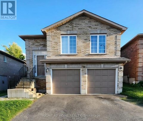 A house with a garage is for sale at Right at Home Realty Brokerage.
