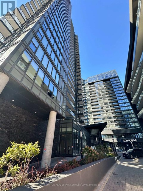 A tall building with a glass facade is seen in the image.