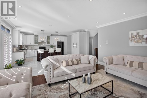 A modern living room with a white sofa and a coffee table.