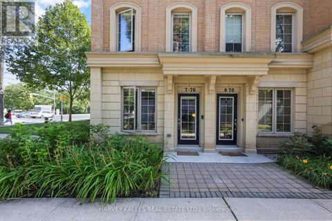 A building with the numbers 7-70 and 8-70 on the windows.