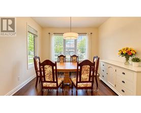 A dining room with a table set for six.