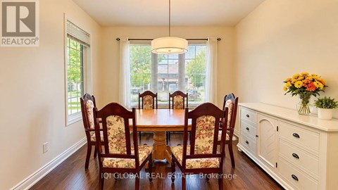 A dining room with a table set for six.