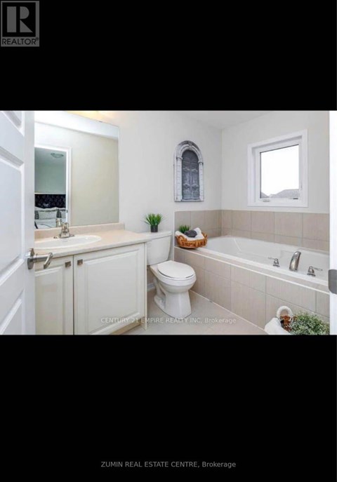 A brochure for a real estate company showing a bathroom.