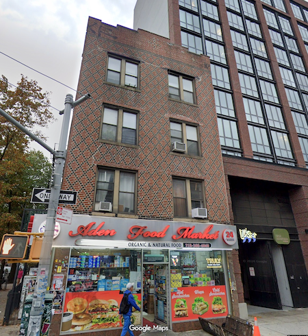 A street view of a building with a sign for Allen Food Markets.