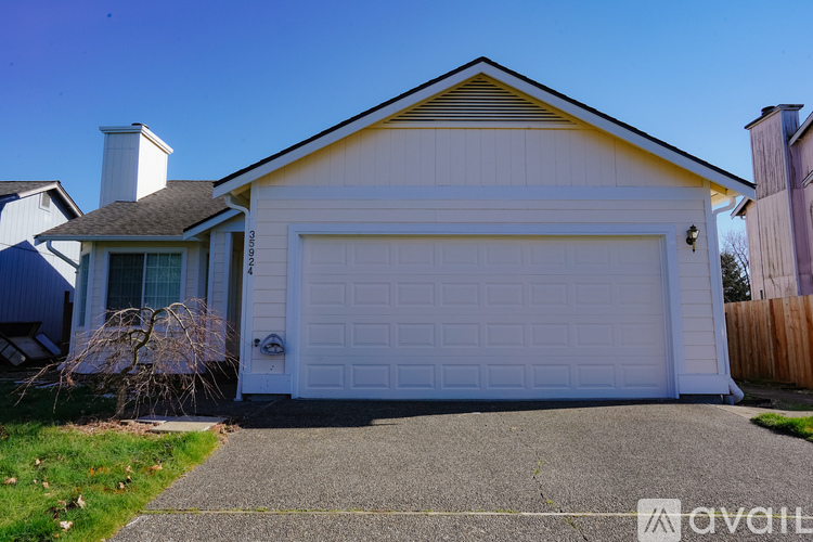 A two-car garage is attached to a house.