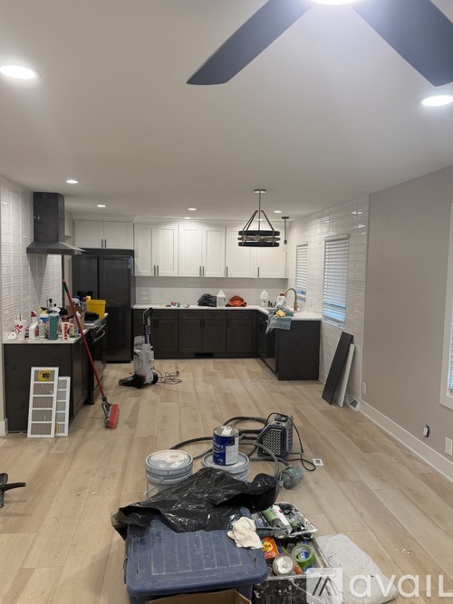 A room with a lot of tools and equipment on the floor.