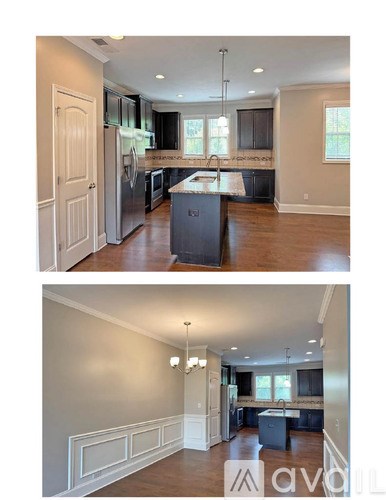 A modern kitchen with a large island and a dining area.
