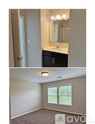 A bathroom with a sink, mirror, and light fixture.
