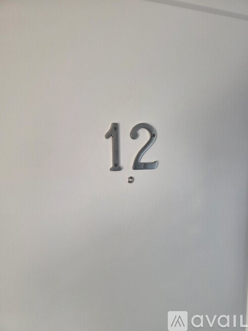 A white door with the number 12 on it.