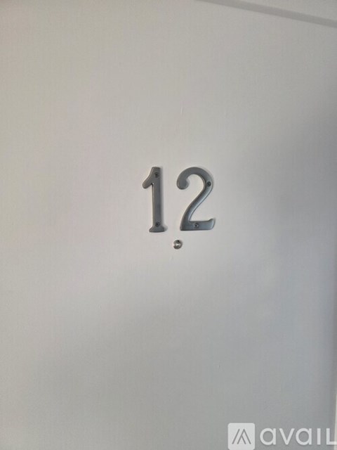 A white door with the number 12 on it.
