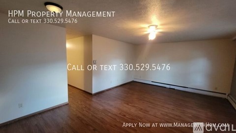A room with HPM Property Management written on the wall.