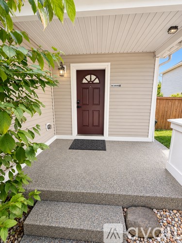 A brown door is on the front of a house.