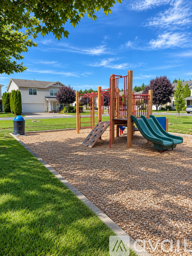 A playground with a slide, swings, and a climbing frame.