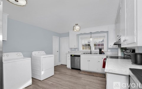 A laundry room with a washer and dryer.