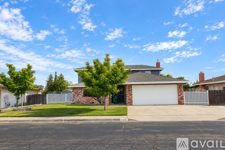 A house with a garage is for sale.