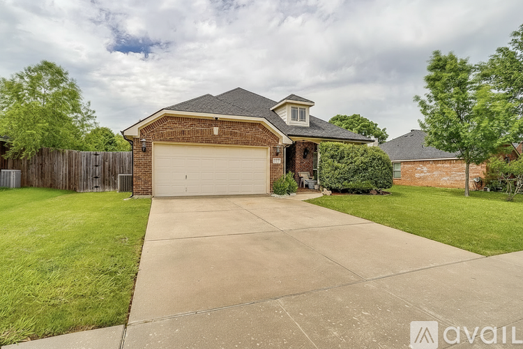 A house with a garage is available for sale.