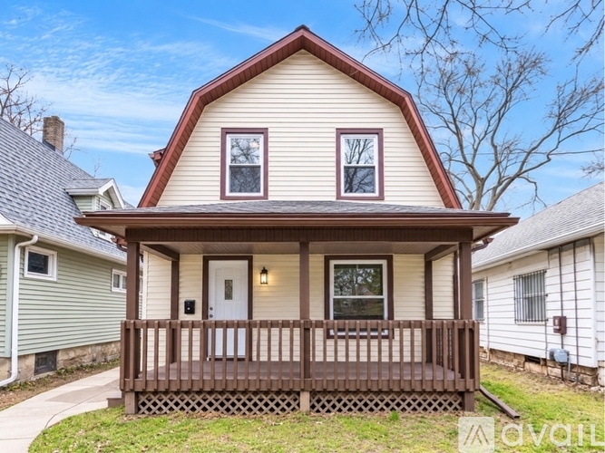 A house with a brown roof and a white door is for sale.