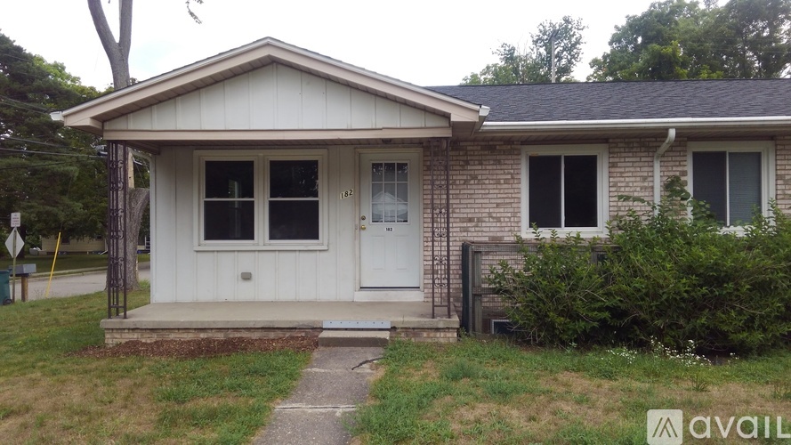 A small house with a white door and windows is available for purchase.